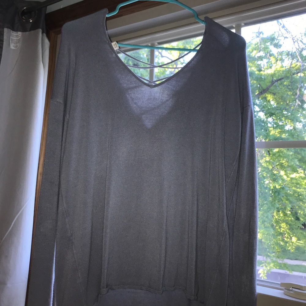 Gargage Long Sleeve Cross Over in the Back.